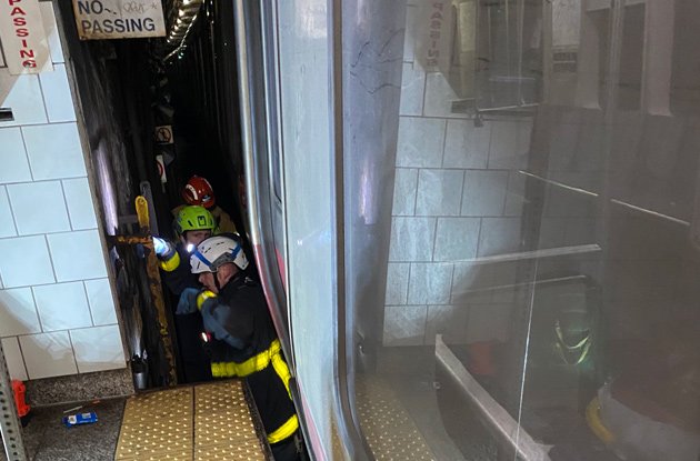 Firefighters at Andrew Red Line stop