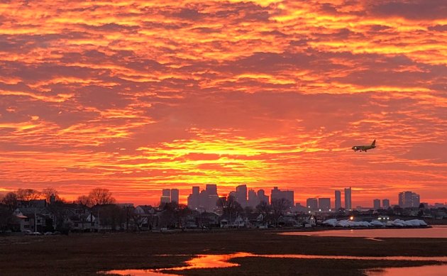 Bright orange sunset over Boston