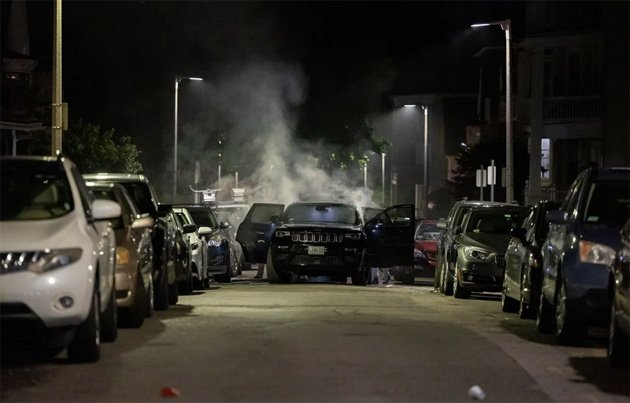 Car smoking after fireworks attack