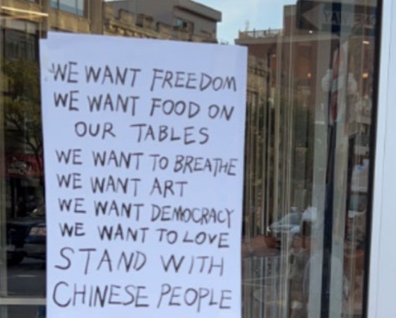 Window poster calling for democracy in China