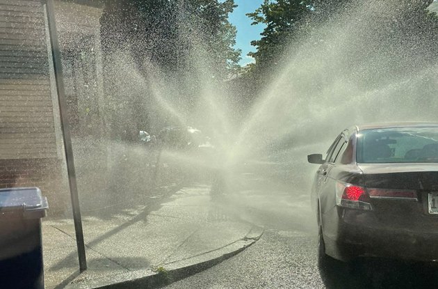 Hydrant opened up on a Boston street