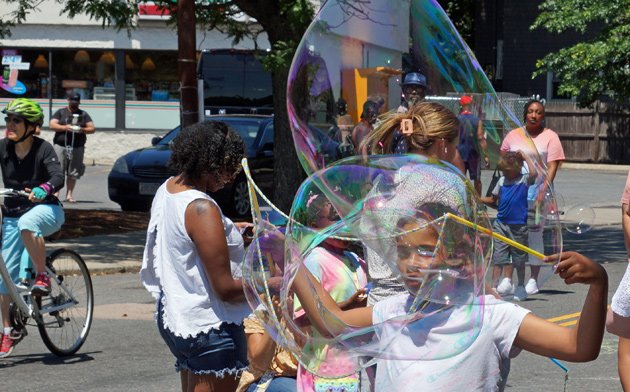 Making bubbles in the centre of Centre Street