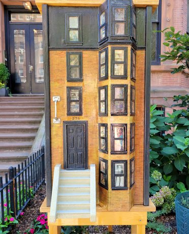 Little Free Library looking like a Back Bay brownstone