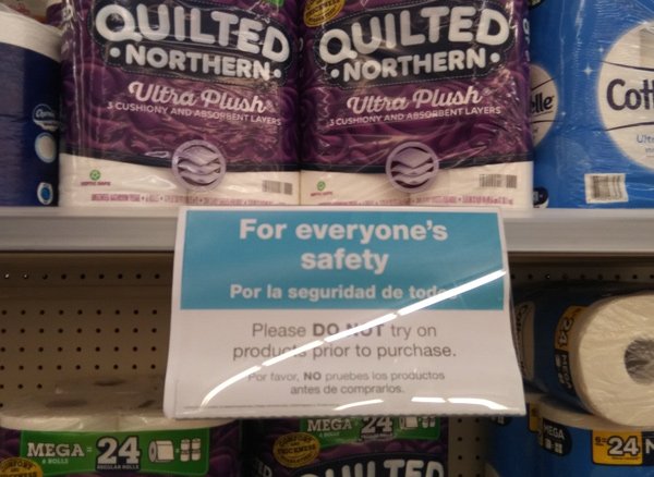 Sign urging people not to try toilet paper before buying it