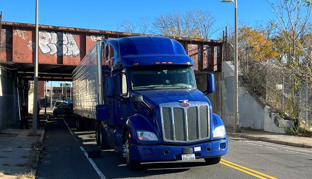 18-wheeler jammed under Freeport Street train bridge