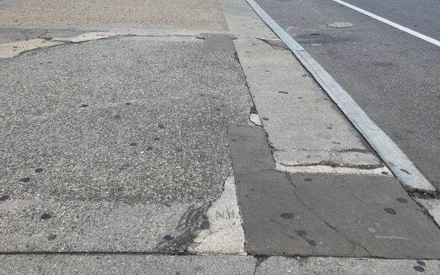 Filled in sidewalk crack that looks like New Hampshire