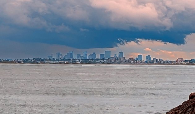 Boston as seen from Swampscott under ominous clouds