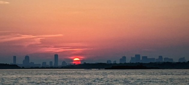 Sunset over Boston Harbor and downtown Boston