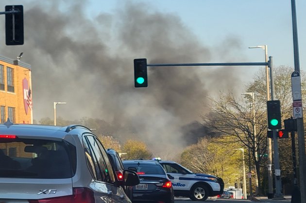 Smoke rising above Cummins Highway and Hyde Park Avenue