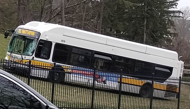 Bus on grass with missing windshield