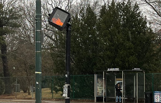 Pedestrian crossing sign knocked out of alignment by wind
