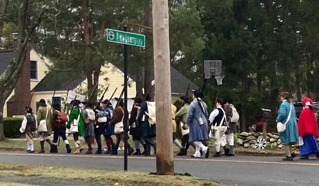 Minutemen and followers marching to Old North Bridge in Concord