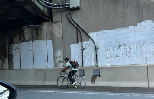 Bicyclist on the Massachusetts Turnpike in Back Bay