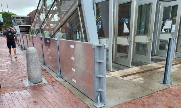 Metal barrier being installed around Aquarium entrance.