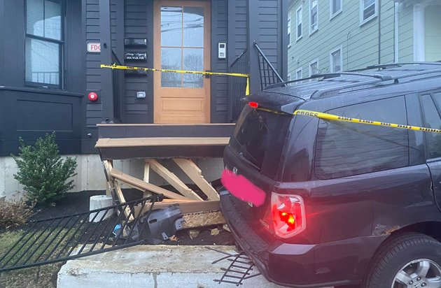 SUV takes off front porch of house on Walk Hill Street