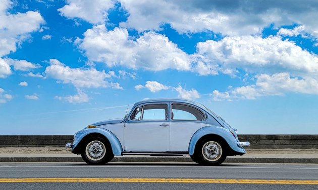 Blue VW Bug against a blue sky