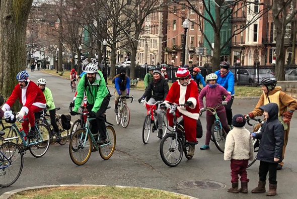 Santa on a bicycle on Commonwealth Avenue in the Back Bay