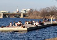 People on a dock in the Charles River in Boston
