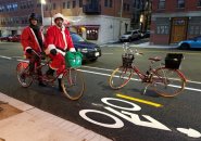 Santas on a tandem bike in Boston's North End