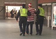 Waldo being escorted out of South Station