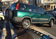 Subaru pushed down fence at the Jamaica Plain Whole Foods