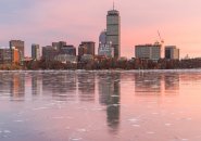 Boston skyline at sunset with ice on the Charles