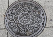 New England Telephone and Telegraph Co. manhole cover on Essex Street in Chinatown