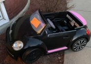Toy car with a parking ticket in Allston