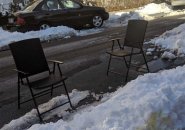 Two chairs used as space savers on Sutherland Road in Brighton