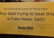 Bernie and Phylls ad that clals other deals Fake News is met with pen scrawl asking them to stop normalizing Trump