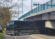 Bus stuck under Neponset River bridge in Quincy