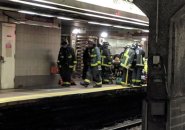 Firefighters getting ready to go on tracks
