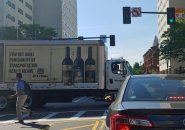 Truck blocking major intersection of Huntington Ave. and Massachusetts Ave. with sign that tells people they can find out what punishment by transportation means