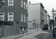 Street scene in old Boston with two young kids