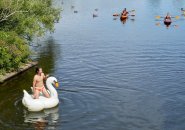 Man in a swan tube in the Charles River