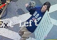 Guy with sign wishing death on people eating dinner outdoors in Marblehead