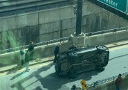 Car on its side at I-93 entrance near South Station