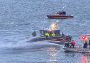 Boston and Massport fire crews pour water on burning boat