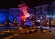 Crash scene in Mattapan - traffic light destroyed, car bursts into flames