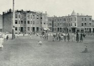 Kids on play field in old Boston