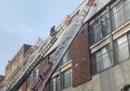 Firefighters on ladders at Symphony Road