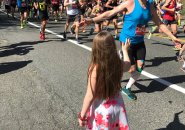 Boston Marathon runners and girl in Ashland