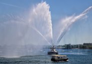 Old fireboat spraying water in Boston Harbor