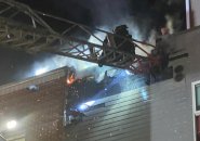 Firefighters on roof of 30 Gurney St.