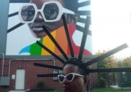 Woman dressed like the McBride Street mural in Jamaica Plain