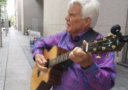 John Davidson with a guitar on Boylston Street outside the BPL