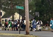 Minutemen and followers marching to Old North Bridge in Concord