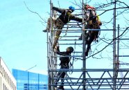 Workers erecting scaffolding at the Boston Marathon finish line