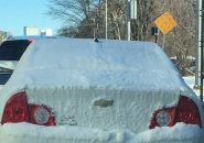 Snow covered car on Tremont Street