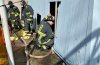 Firefighter checks under MRI structure at VA Hospital